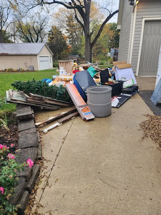 Dumpster being loaded with debris for Commercial Dumpster Rental in Philadelphia